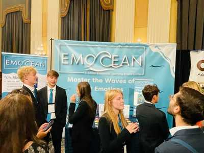 emocean team talks with trade show attendees